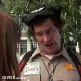 A Man In A Scout Uniform Is Talking To A Girl . GIF