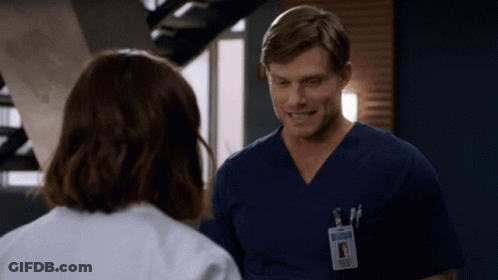 Man With Name Tag Chris In Scrubs GIF
