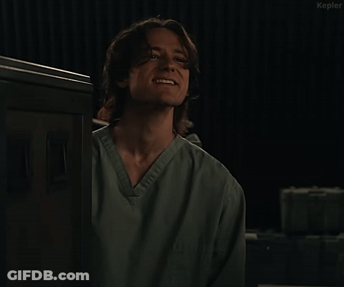 Man In Scrub Top Saying It's Getting Tense GIF