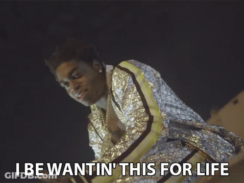 A Man In A Sequined Jacket With The Words I Be Wantin ' This For Life Below Him GIF