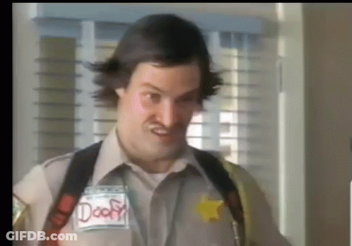 A Man In A Sheriff 'S Uniform Has A Name Tag That Says Deaf GIF