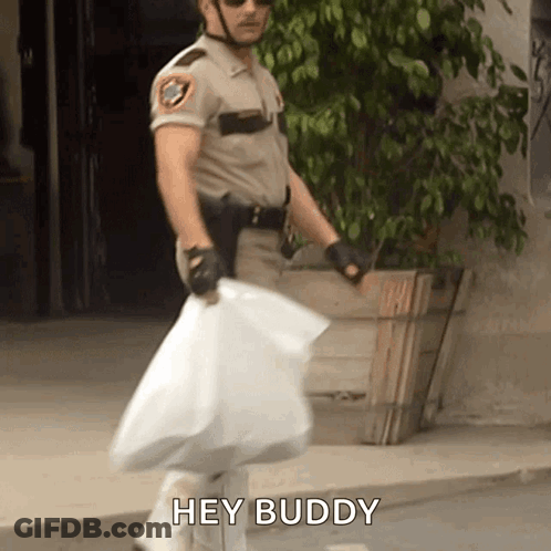A Man In A Sheriff 'S Uniform Is Carrying A Large Bag And Says Hey Buddy GIF
