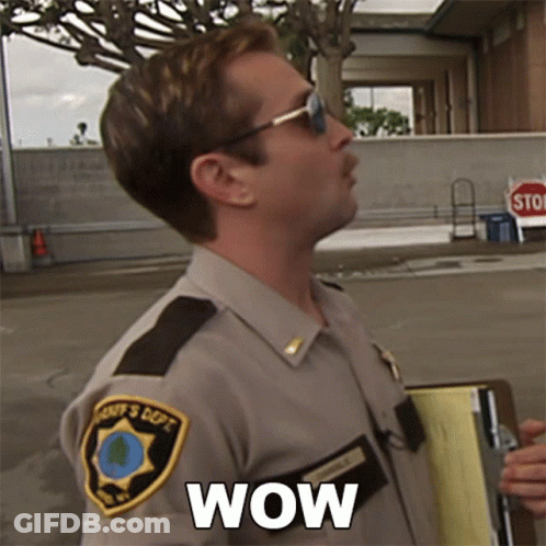 A Man In A Sheriff 'S Uniform Is Holding A Clipboard And Says Wow GIF