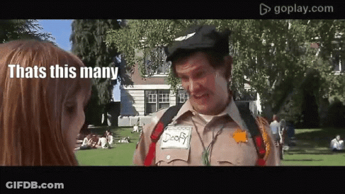 A Man In A Sheriff 'S Uniform Talks To A Girl In A Park GIF