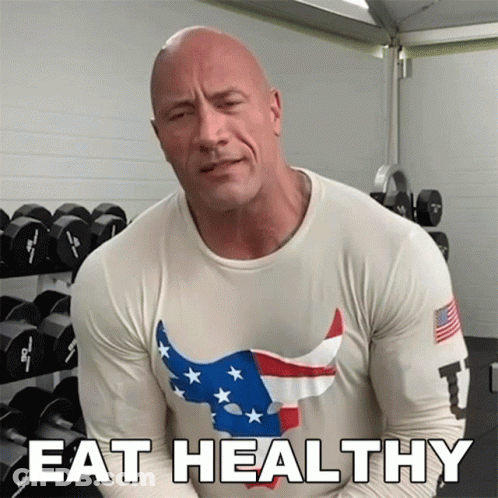 A Man In A Shirt That Says Eat Healthy GIF