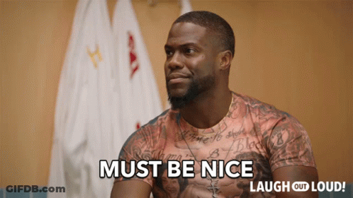 A Man In A Shirt That Says Must Be Nice On It GIF