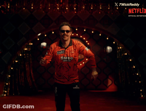 A Man In A Shree Cement Shirt Is Dancing GIF