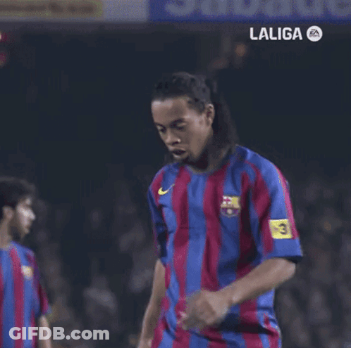 A Man In A Siemens Shirt Stands Next To Another Man In An Adidas Shirt GIF