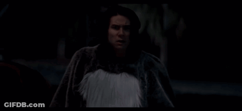 A Man In A Skeleton Shirt Is Looking At The Camera GIF