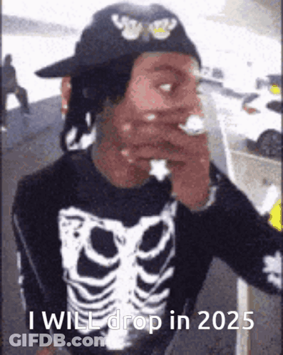 A Man In A Skeleton Shirt Is Smoking A Cigarette And Says `` I Will Drop In 2025 '' . GIF