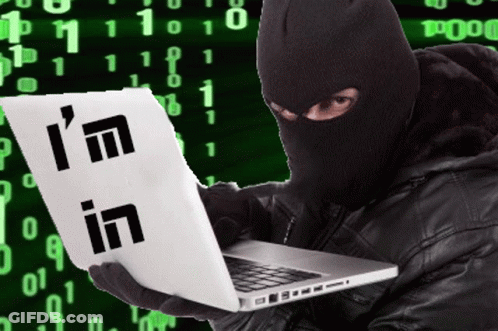 A Man In A Ski Mask Is Holding A Laptop And A Sign That Says I 'M In GIF