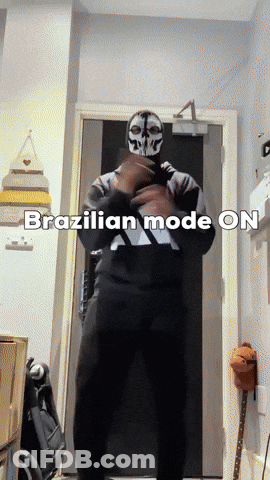 A Man In A Skull Mask Is Standing In Front Of A Door With The Words Brazilian Mode On Written Below Him GIF