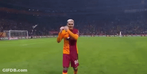 A Man In A Soccer Uniform Is Standing On A Soccer Field . GIF