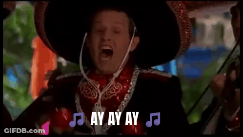 A Man In A Sombrero Is Holding A Microphone And Saying Ay , Ay , Ay , Ay GIF