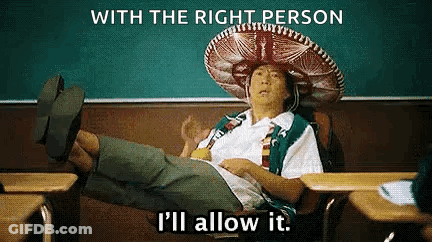 A Man In A Sombrero Is Sitting At A Desk In A Classroom With His Feet Up . GIF