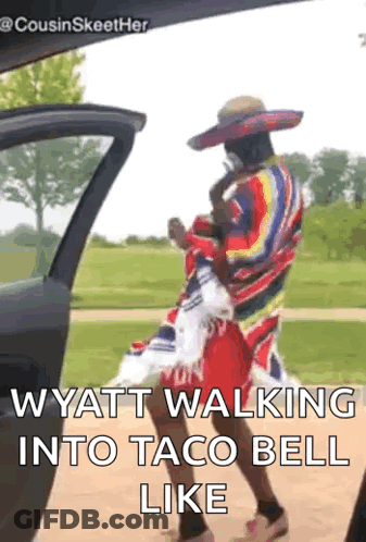 A Man In A Sombrero Is Walking Into A Taco Bell Like . GIF