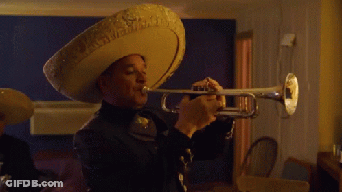 A Man In A Sombrero Plays A Trumpet GIF