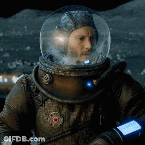 A Man In A Space Suit Has A Watch On His Wrist That Says ' I 'M Sorry ' On It GIF
