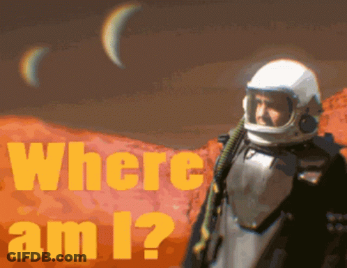 A Man In A Space Suit Is Standing In Front Of A Poster That Says Where Am I GIF