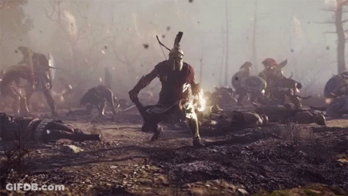 A Man In A Spartan Helmet Holds A Sword In A Battle Scene GIF