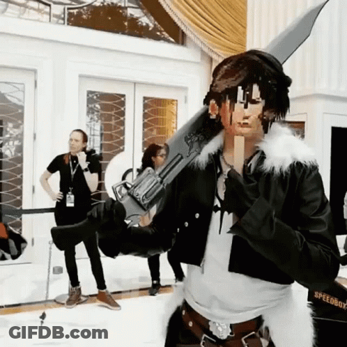 A Man In A Speedboy Costume Is Holding A Sword GIF