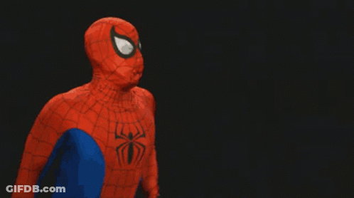 A Man In A Spider Man Costume Is Covered In A Spider Web GIF