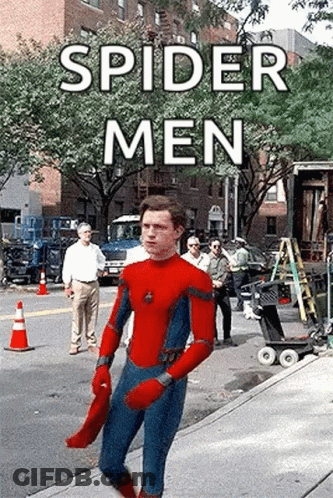 A Man In A Spider-Man Suit Is Walking Down A Sidewalk . GIF