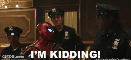 A Man In A Spider Man Suit Says I 'M Kidding In Front Of Two Police Officers GIF