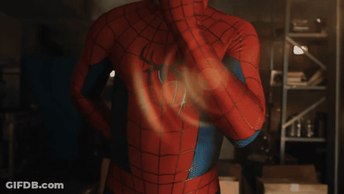 A Man In A Spiderman Costume Has A Spider On His Chest GIF