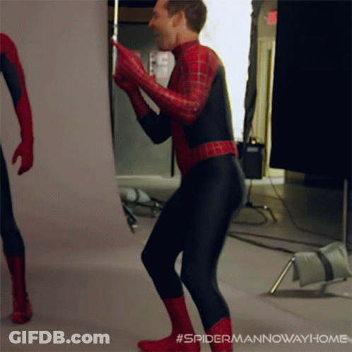A Man In A Spiderman Costume Is Dancing In A Room GIF