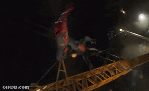 A Man In A Spiderman Costume Is Flying Through The Air GIF