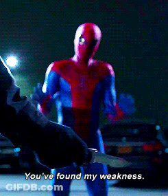 A Man In A Spiderman Costume Is Holding A Knife And Says You 'Ve Found My Weakness GIF