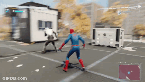 A Man In A Spiderman Costume Is Playing A Video Game . GIF