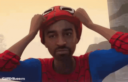 A Man In A Spiderman Costume Is Putting On A Hat GIF