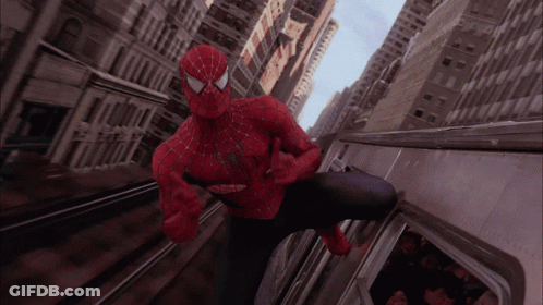 A Man In A Spiderman Costume Is Riding A Subway GIF