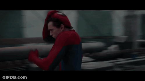A Man In A Spiderman Costume Is Running GIF