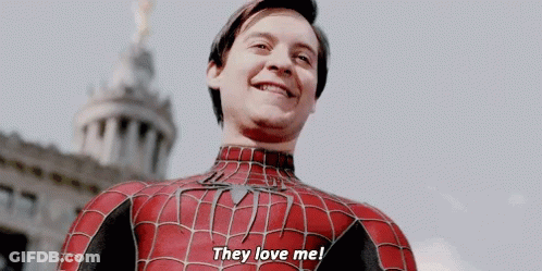 A Man In A Spiderman Costume Is Smiling And Saying They Love Me GIF