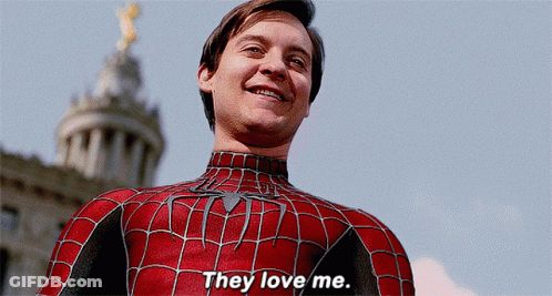 A Man In A Spiderman Costume Is Smiling And Says They Love Me GIF