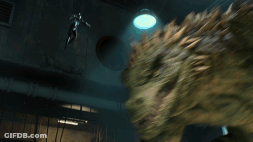 A Man In A Spiderman Costume Is Standing In A Room With A Yellow Triangle On The Floor GIF