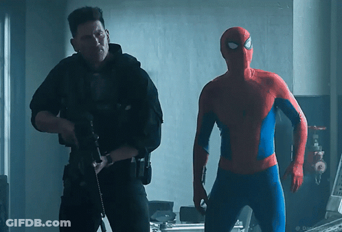 A Man In A Spiderman Costume Is Standing Next To A Man In A Black Uniform GIF