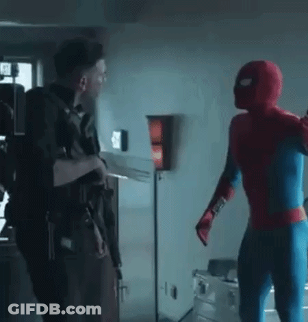 A Man In A Spiderman Costume Is Standing Next To Another Man In A Spiderman Costume . GIF