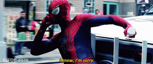 A Man In A Spiderman Costume Is Talking On A Cell Phone GIF