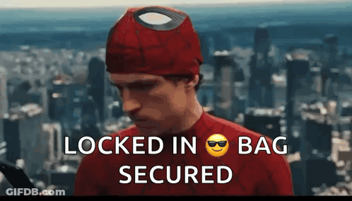 A Man In A Spiderman Costume With The Words Locked In Bag Secured Written Below Him GIF