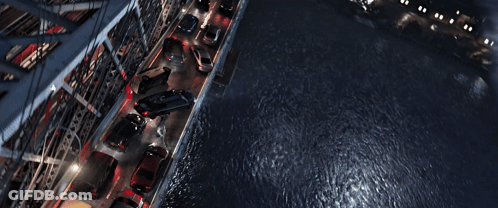 A Man In A Spiderman Suit Is Flying Over A City GIF