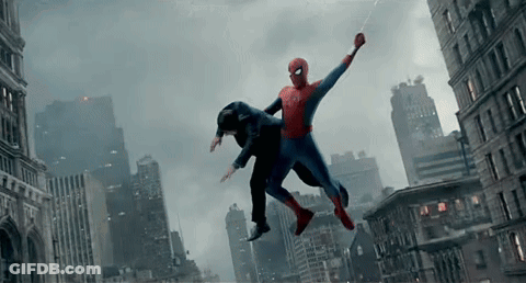 A Man In A Spiderman Suit Is Flying Through The Air GIF