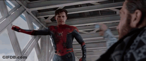 A Man In A Spiderman Suit Is Standing Next To A Man In A Black Shirt . GIF