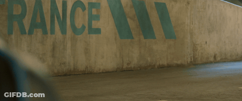 A Man In A Spiderman Suit Is Walking In Front Of A Wall That Says Rance GIF