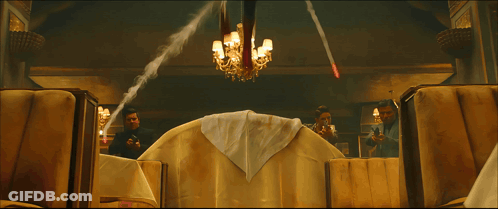 A Man In A Spiderman Suit Sits On A Couch GIF