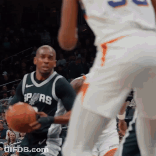 A Man In A Spurs Jersey Holds A Basketball In His Hands GIF