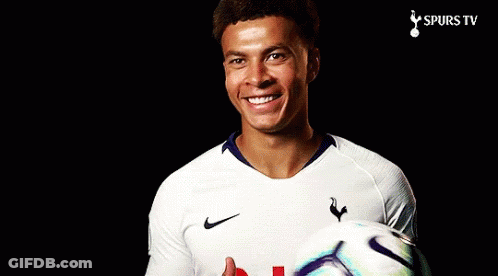 A Man In A Spurs Jersey Holds A Soccer Ball GIF